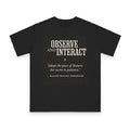 Observe and Interact design on black organic cotton t-shirt by Emogine — GOTS-certified regenerative agriculture apparel