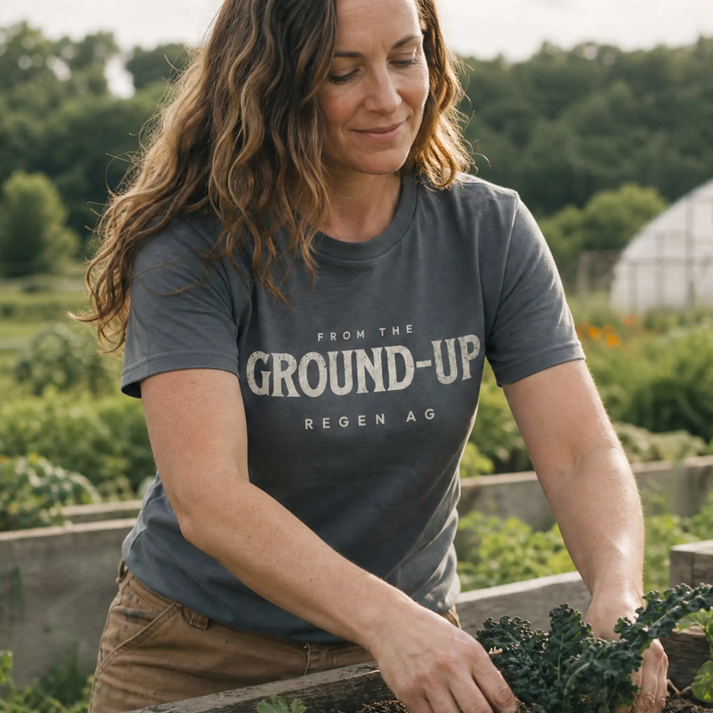Regenerative Agriculture organic cotton t-shirt worn by woman on a regenerative farm with polyculture plantings in the background